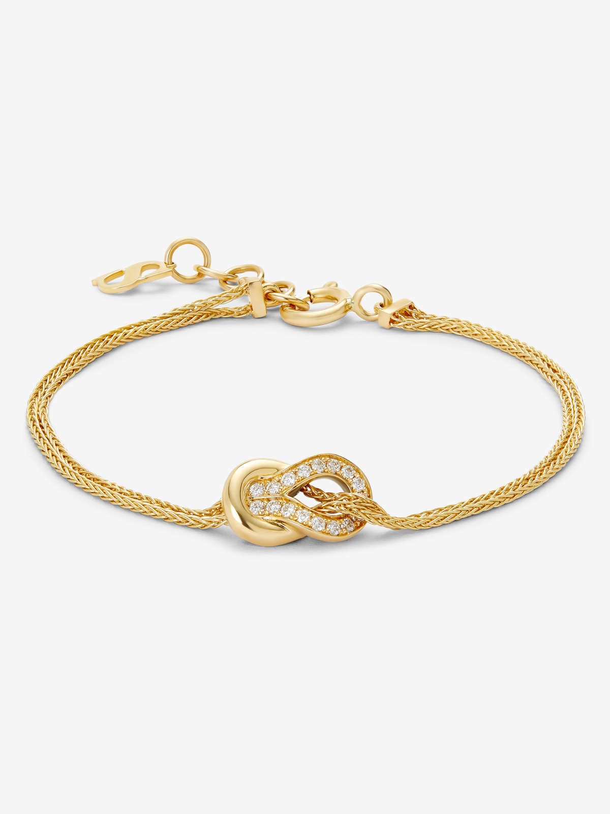 18K yellow gold bracelet with 17 brilliant-cut diamonds with a total of 0.15 cts and a knot shape