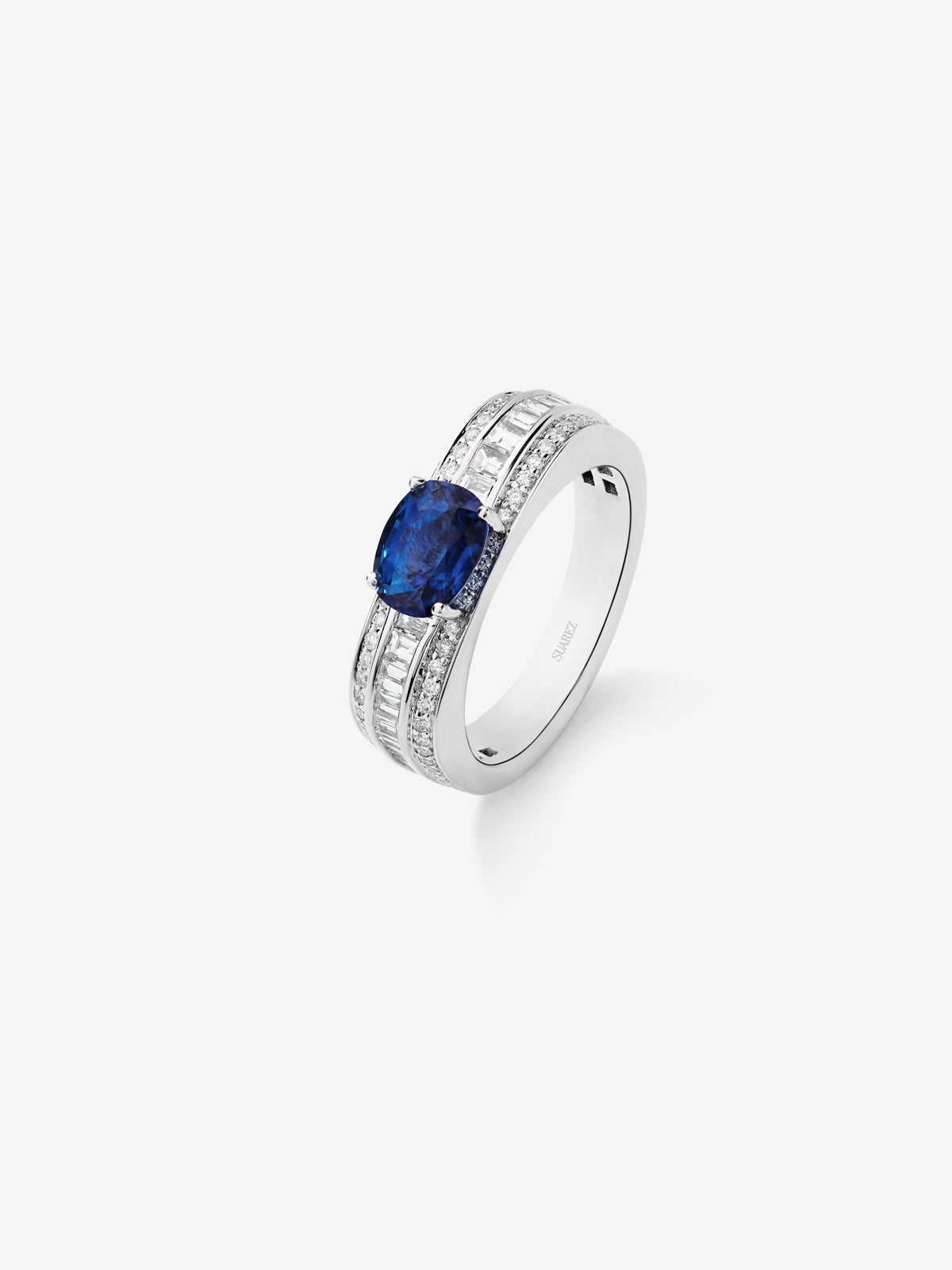 18K white gold ring with royal blue sapphire in cushion cut of 1.56 cts and 96 diamonds in baguette and brilliant cut with a total of 0.71 cts