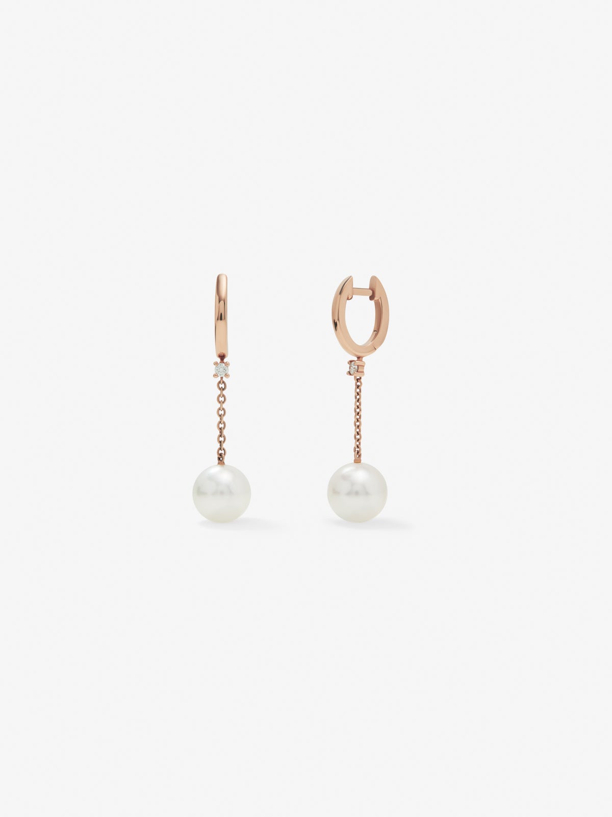 18kt rose gold chain earrings with Australian pearls and diamonds.